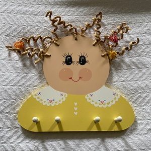 Lil Bow Keep wall mount with wooden dowels